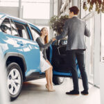 Elegant couple in a car salon