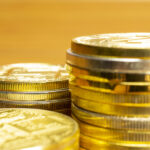Rows, stacks of coins with blurred background, selective focus o