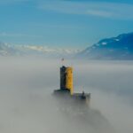 aerial photography of mountains and tower