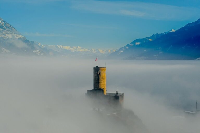 aerial photography of mountains and tower